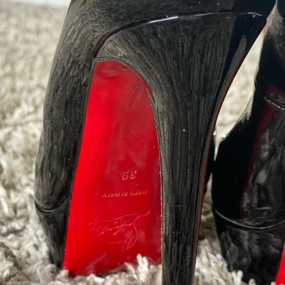 Christian Louboutin black patent leather pumps